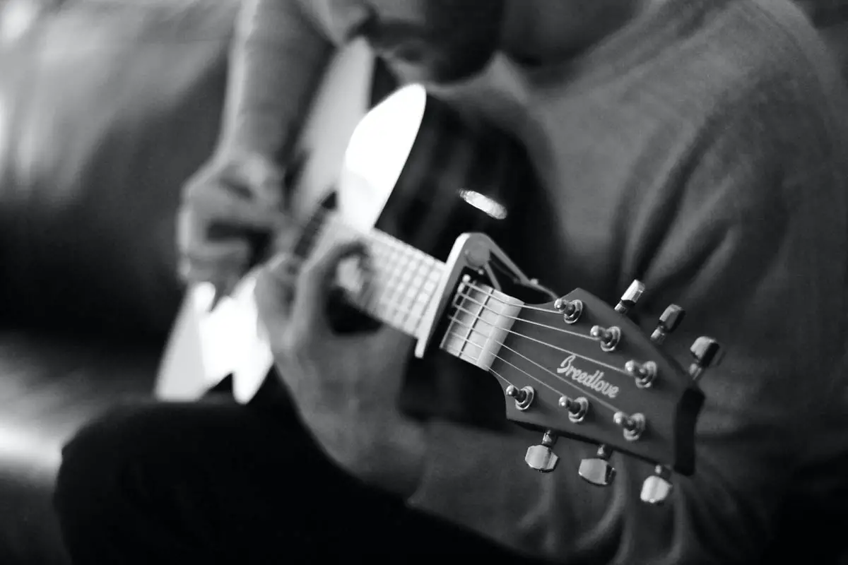 Breedlove Guitar with capo being played