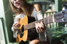 Girl playing acoustic guitar