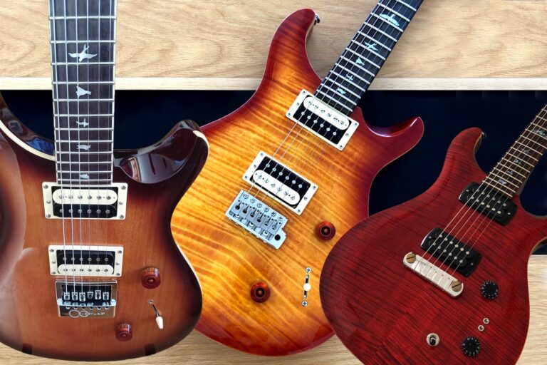 PRS electric guitars on wood background