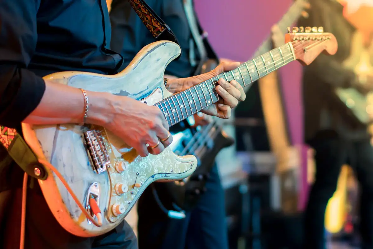 guitarist playing vintage guitar on stage