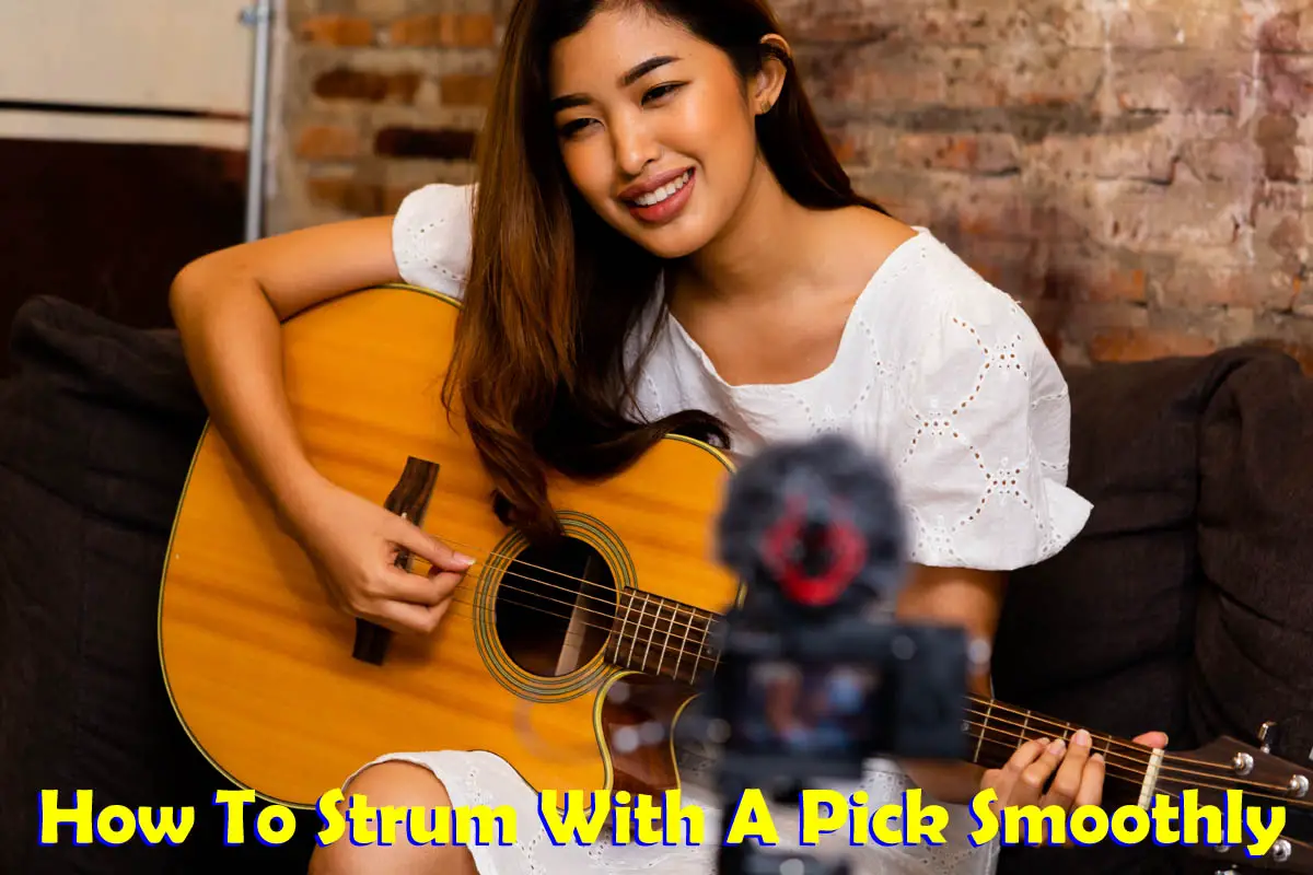 Asian woman strumming guitar