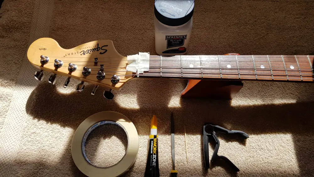 Filling a guitar nut slot with bicarbonate soda and super glue