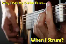 Acoustic guitar player strumming guitar