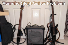 Yamaha Silent guitars on stands on either side of amplifier
