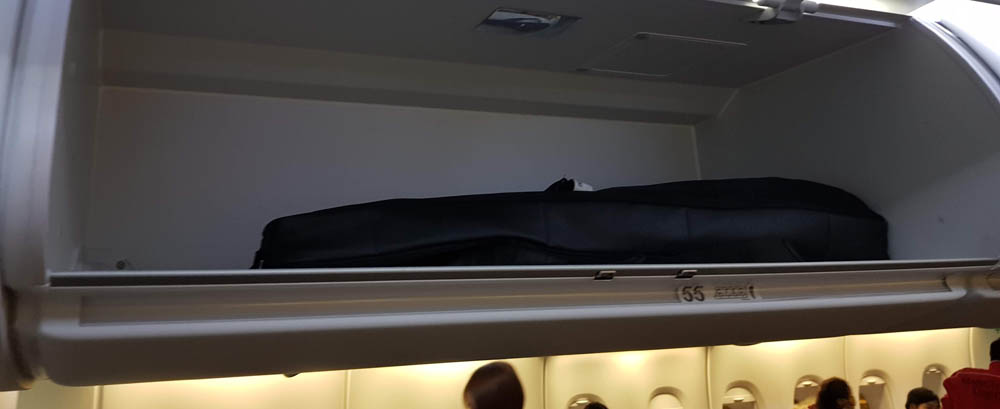 Yamaha silent guitar in airplane overhead locker