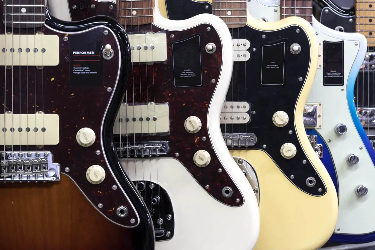 Closeup view of jazzmaster guitars in a row